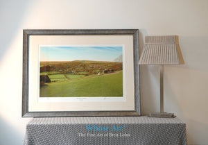 A Framed landscape wall art print of a painted autumnal landscape, showing the view from Box Hill across the south Downs.