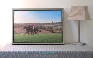 Galloping horse wall art print of two horses galloping on Epsom Downs in February. Printed on Canvas and framed in silver.