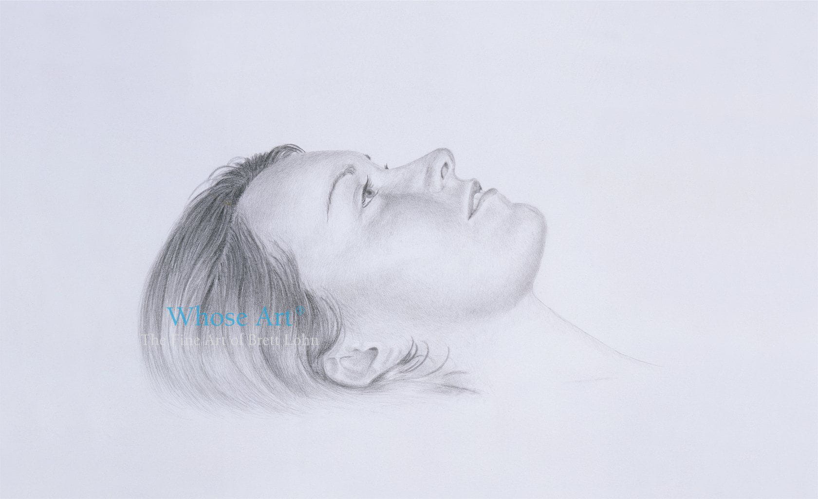 Pencil drawing greeting card featuring a drawing of a daydreaming girl's face as she lies down, looking upwards 