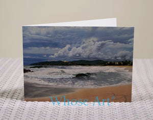 Ocean waves seascape greeting card on a table.