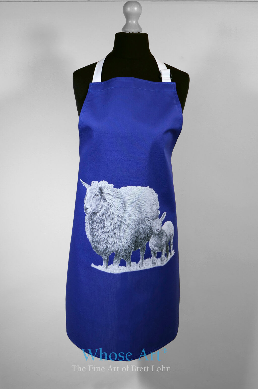 Sheep lover gift idea of a navy kitchenware apron with sheep and lamb drawing on the front