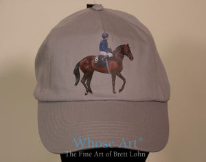 Yeats horse on a hat. The hat is grey. The horse is not.