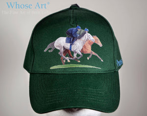 galloping horses baseball cap with horses galloping on the front of a green hat