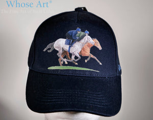 Racehorse gift idea blue hat with a painting of two racehorses galloping, printed on the front