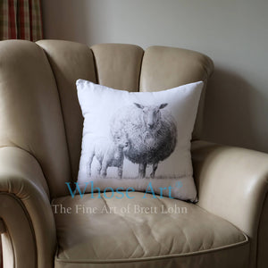 Sheep art cushion placed on an armchair