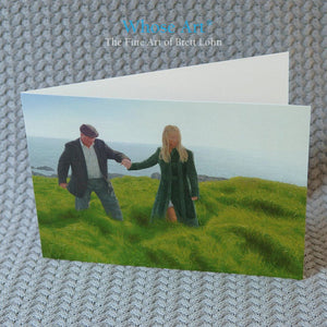 Art greeting card of a painting of an Irish art scene showing a man being gently guided by the hand through long grass