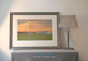 A Framed horse racing art print of Epsom Downs beneath a stormy sunset as the final evening race concludes in the distance.