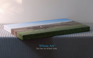 Horses canvas gallery wrap. This horse art print is laying flat on a table to display the canvas edges. Painting is of horses