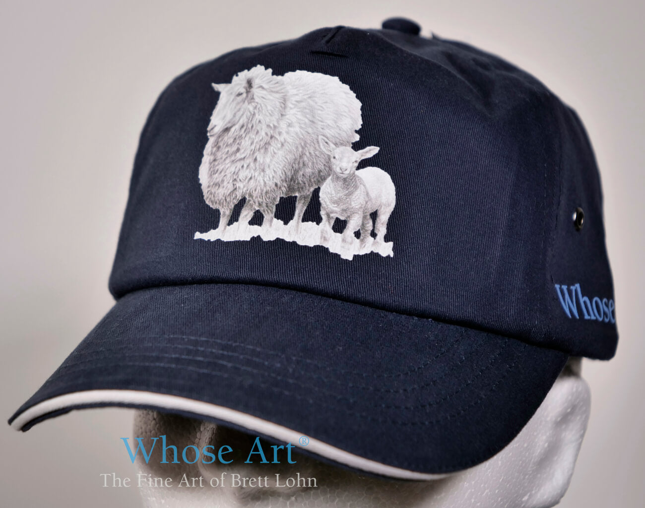 sheep accessories a navy hat with sheep on the front