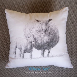 Sheep cushion with drawing of lamb and sheep.